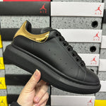Alexander McQueen Gold Black Drip Sneakers