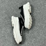 Alexander McQueen Black and White Drip Sneakers