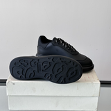 Alexander McQueen Oversized Black Drip Sneakers