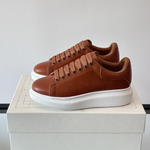 Alexander McQueen Oversized White/Orange Drip Sneakers