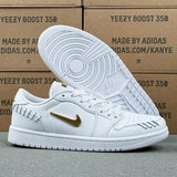 AJ1 Low Sail Metallic Gold